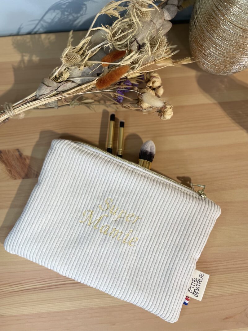 pochette plate en velours côtelé beige avec broderie